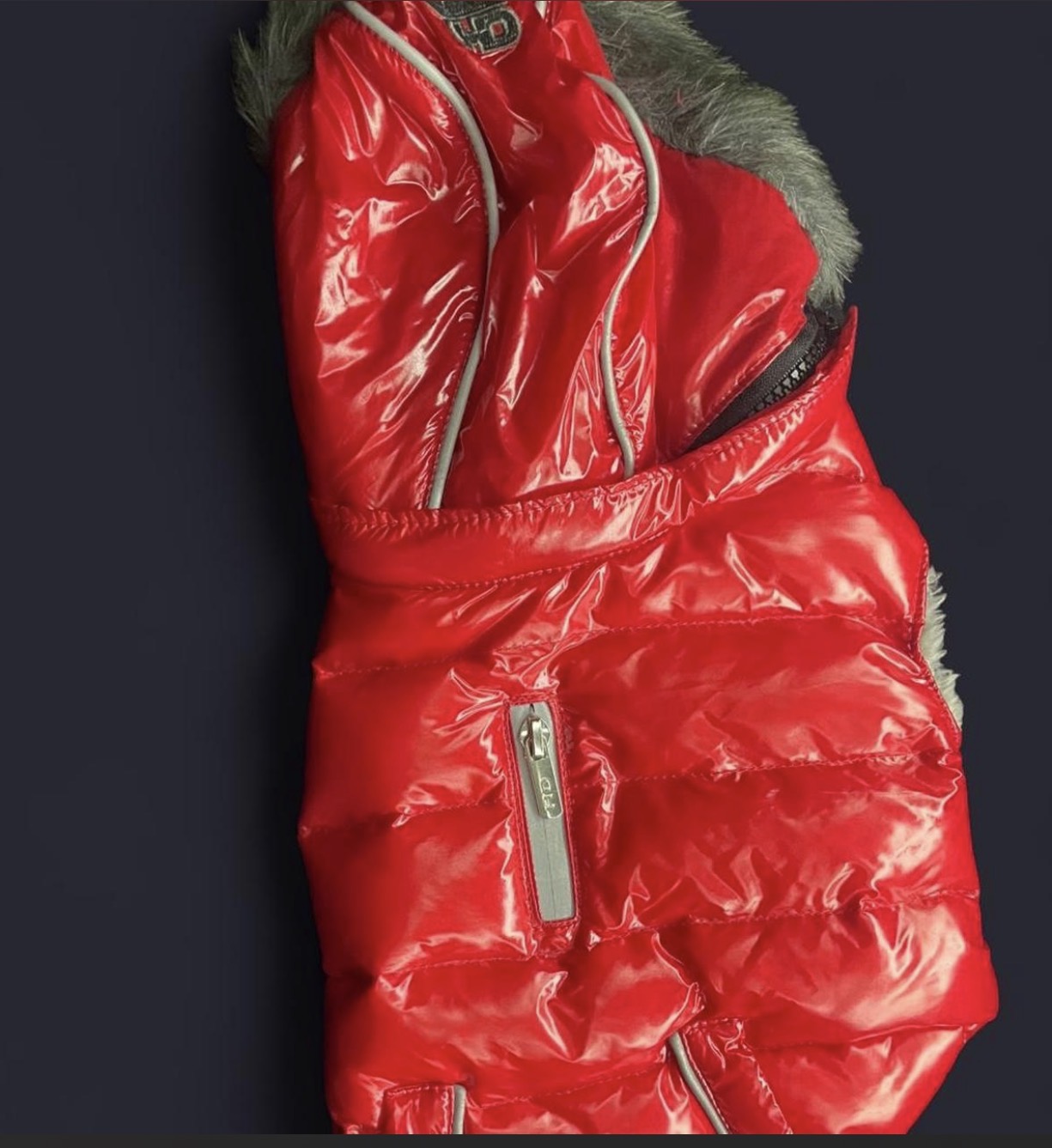 Hip Doggie Elite Reflective Coat, a high-gloss puffer vest designed for small to large dogs.